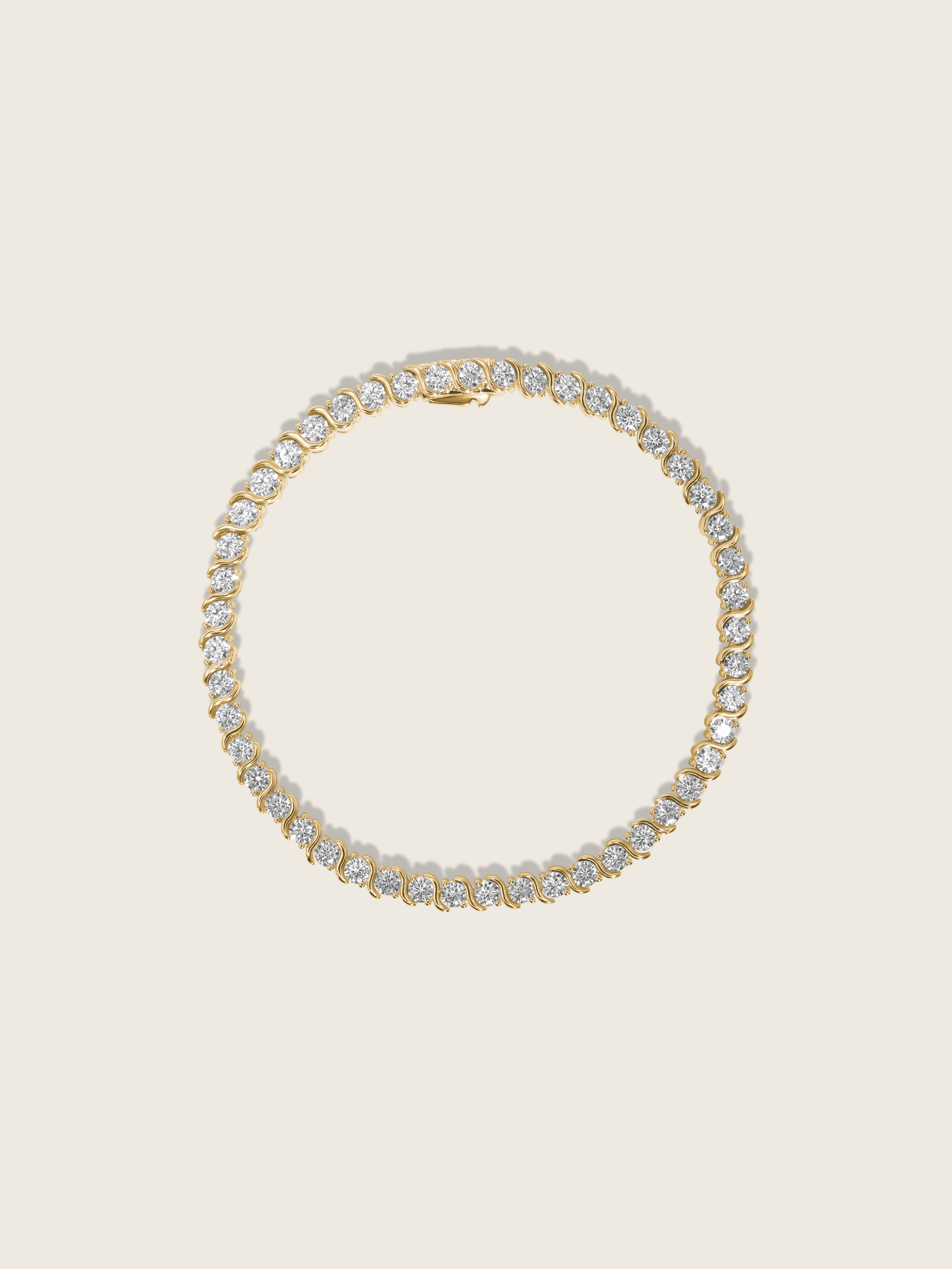 Estelle tennis bracelet 14k gold plated with cubic zirconia stones in S-link chain, circular flatlay