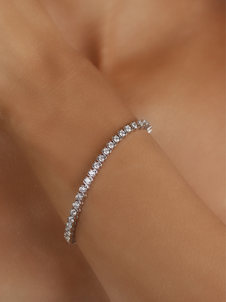 Estelle tennis bracelet premium white gold plated cubic zirconia S link design shown on model wrist
