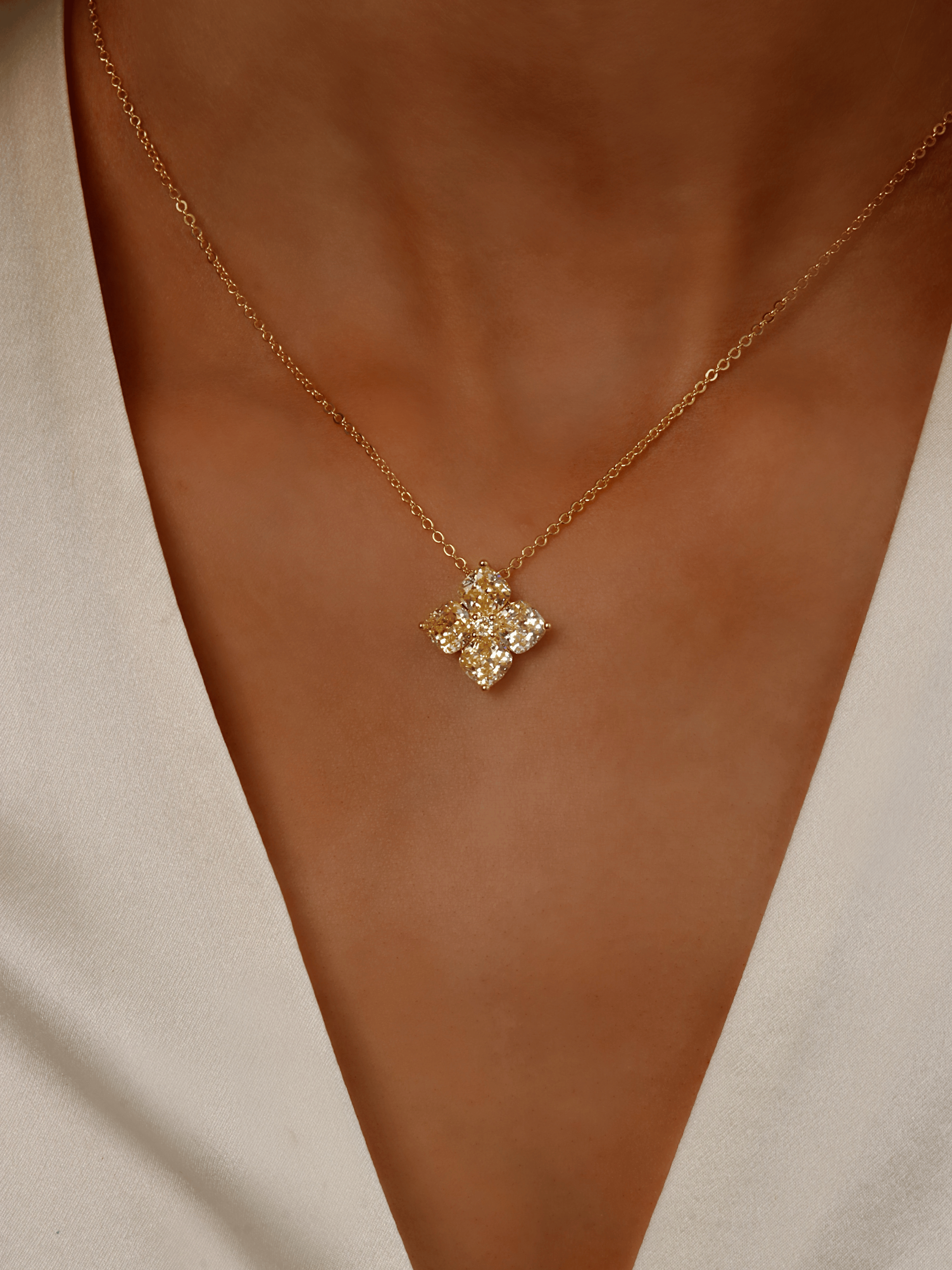 Close-up of model wearing White Gold Crystal Hydrangea Necklace in Lemon Drop, showing CZ flower detail