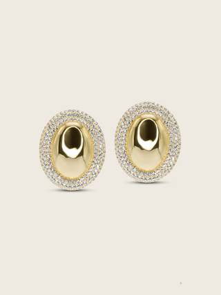 Gold plated Gigi Oval stud earrings with sparkly CZ stones around the outside, perfect for formal occasions and events, shot on a neutral background