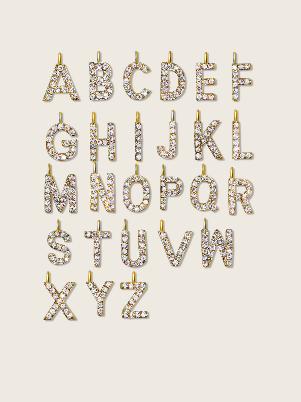 A to Z gold plated initial charms with cubic zirconia stones, designed to personalise the Love Letter bracelet or necklace with your chosen letter