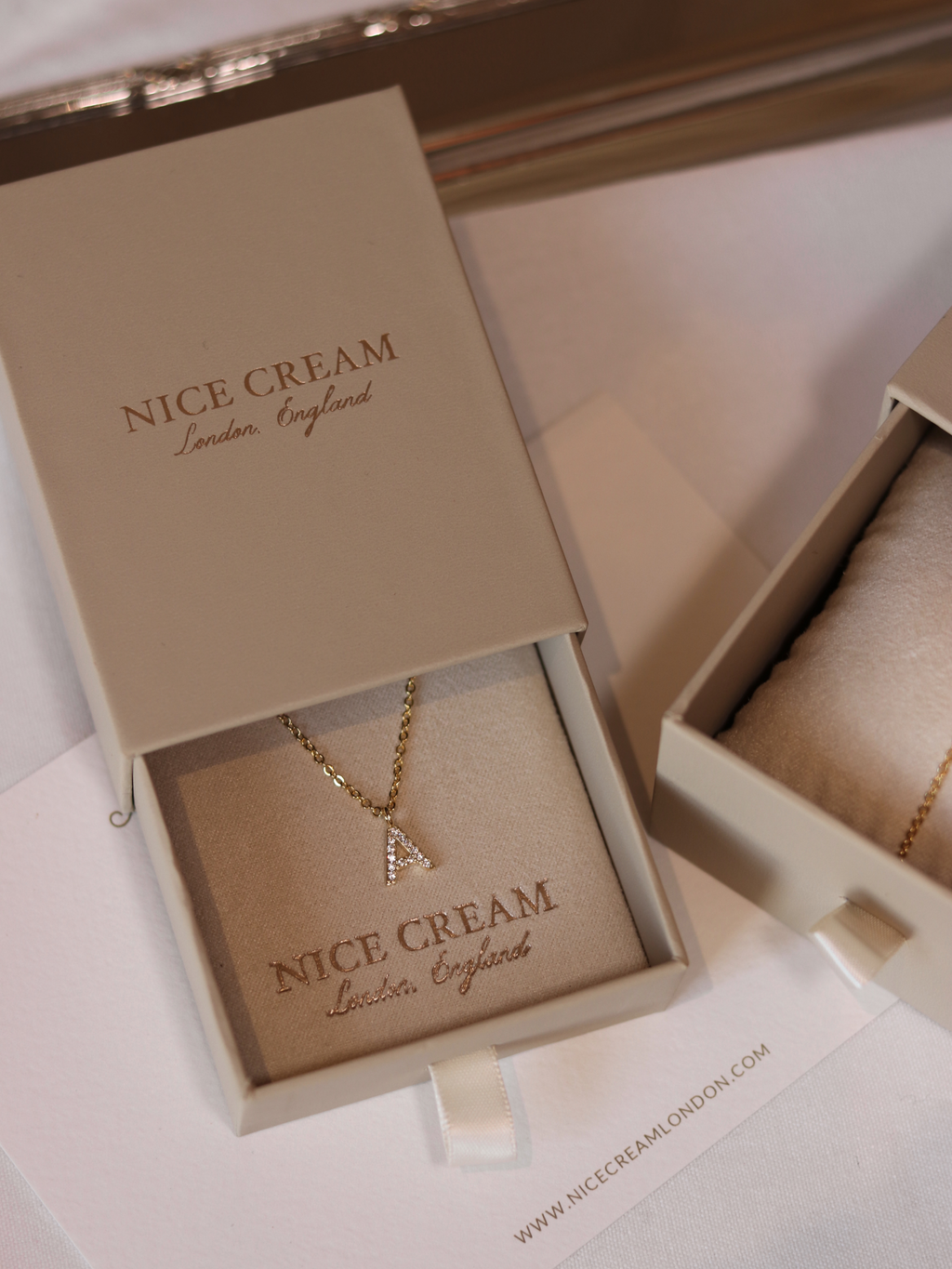 Gold Love Letter necklace with CZ A charm presented in branded Nice Cream London jewellery box, ideal for gifting with personalised elegance