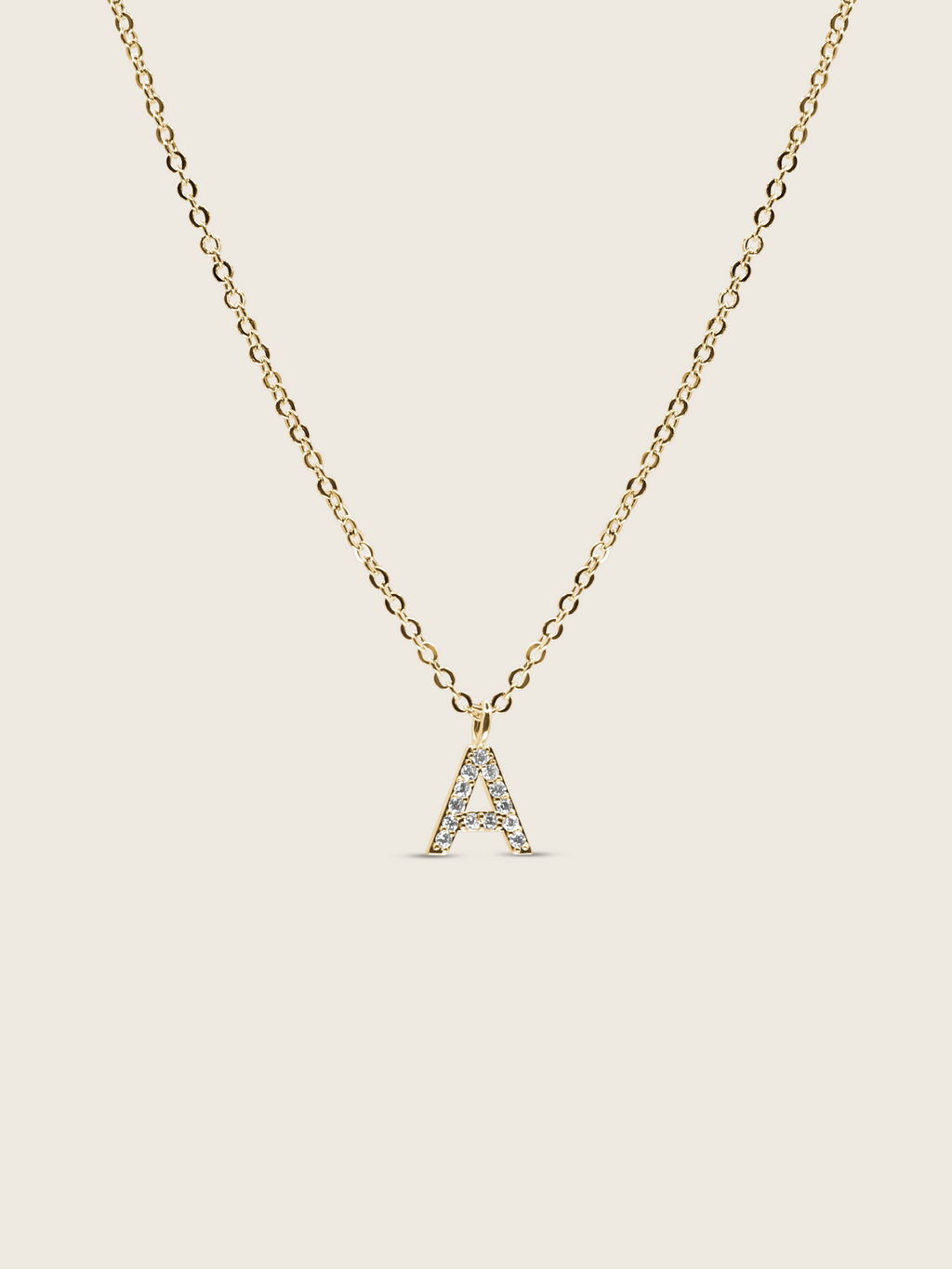 Customisable gold plated initial necklace with cubic zirconia A charm on a delicate chain, matching the Love Letter bracelet design