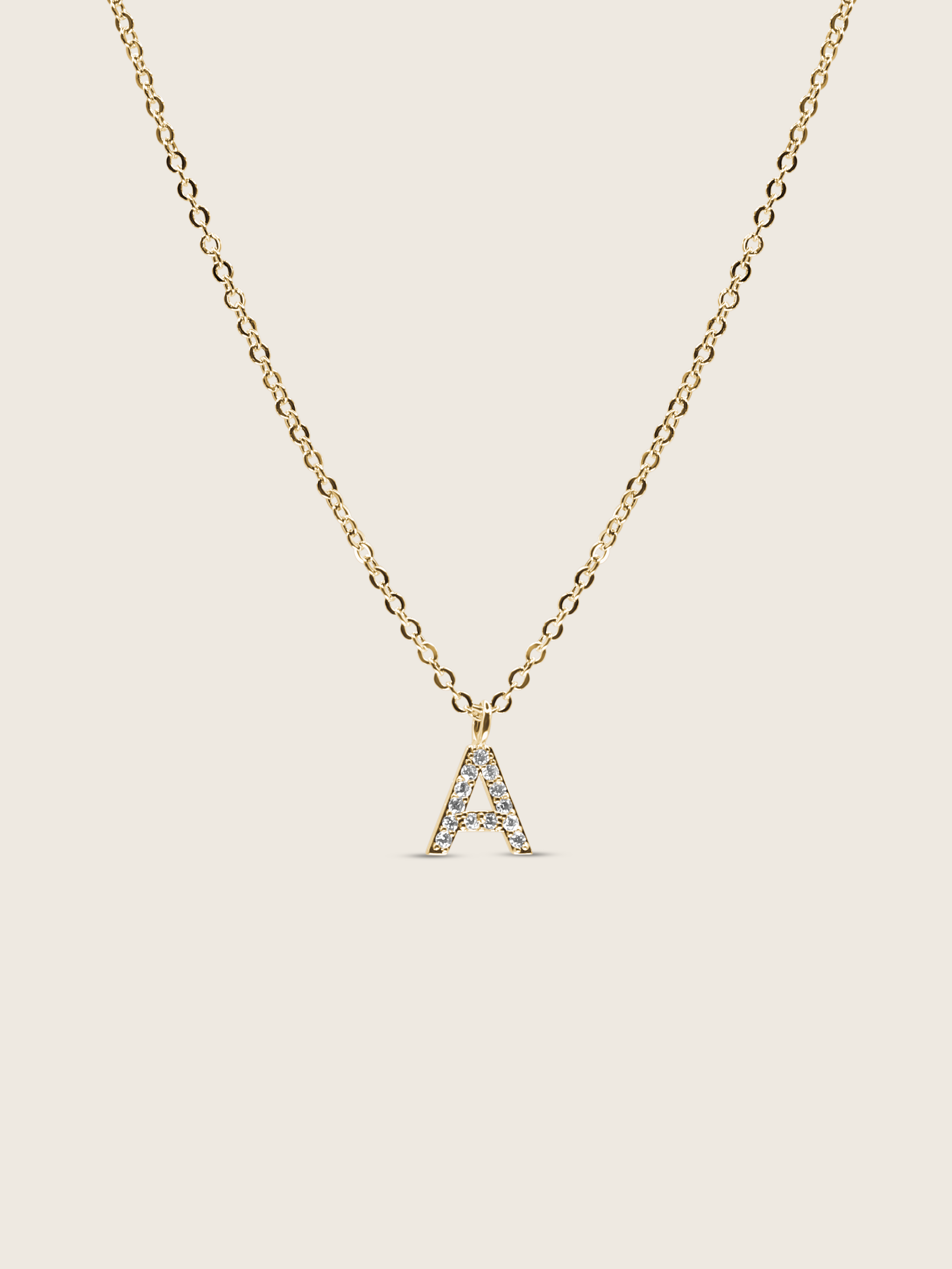 Customisable gold plated initial necklace with cubic zirconia A charm on a delicate chain, matching the Love Letter bracelet design