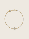 Flatlay of gold plated Mini Hydrangea bracelet with single flower charm and lobster clasp