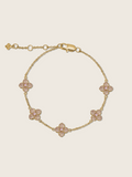 Gold plated bracelet with five light pink cubic zirconia hydrangea charms on fine chain, delicate floral design ideal for soft styling or gift-giving