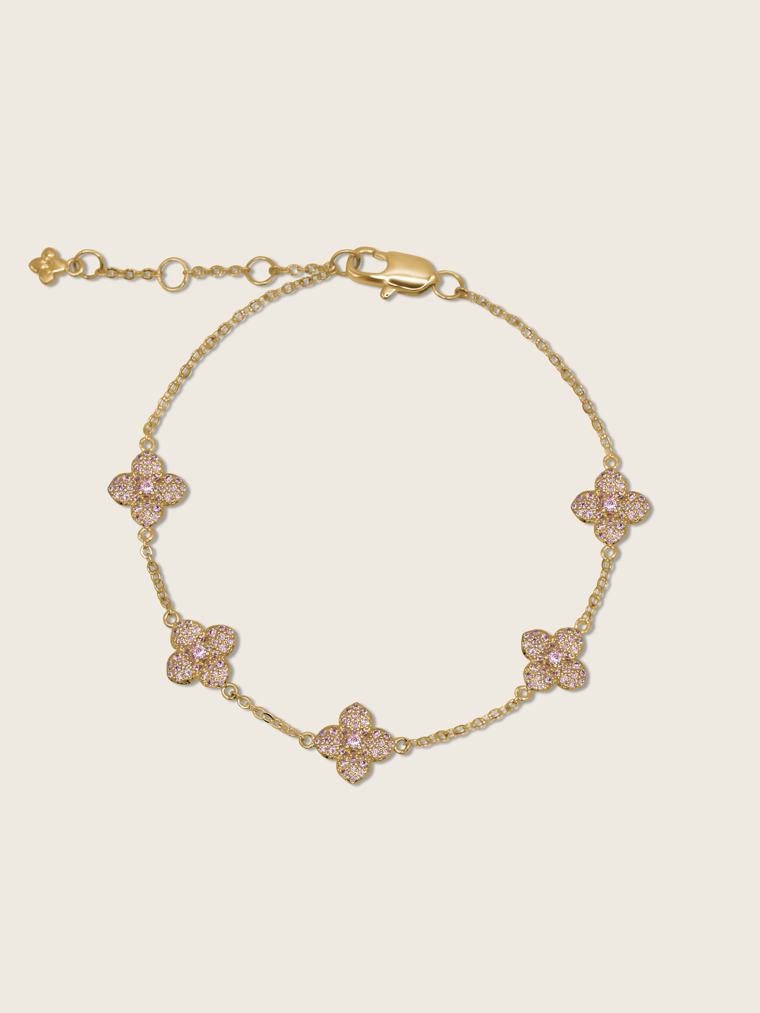 Gold plated bracelet with five light pink cubic zirconia hydrangea charms on fine chain, delicate floral design ideal for soft styling or gift-giving