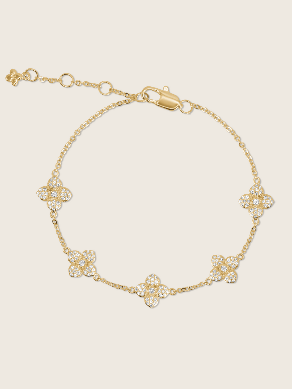  Flatlay of gold Multi Mini Hydrangea bracelet showing crystal-encrusted flowers