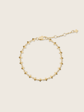 Gold plated micro hydrangea bracelet displayed flatly on a white background, showcasing the detailed design of the chain bracelet.