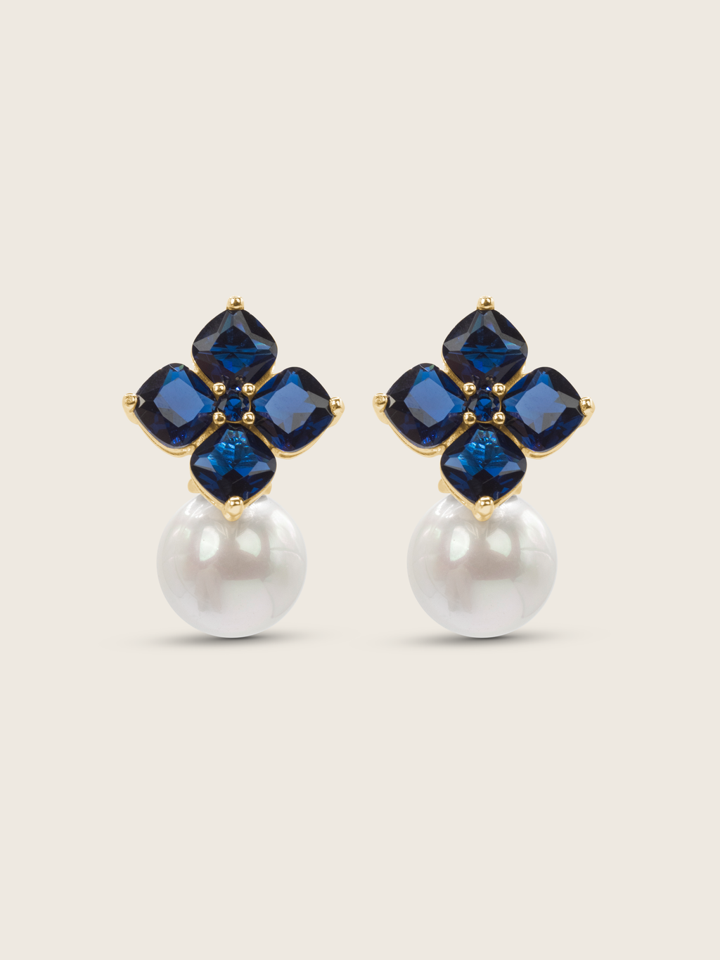 14k gold plated hydrangea earrings with translucent deep blue cubic zirconia stones and shell pearls