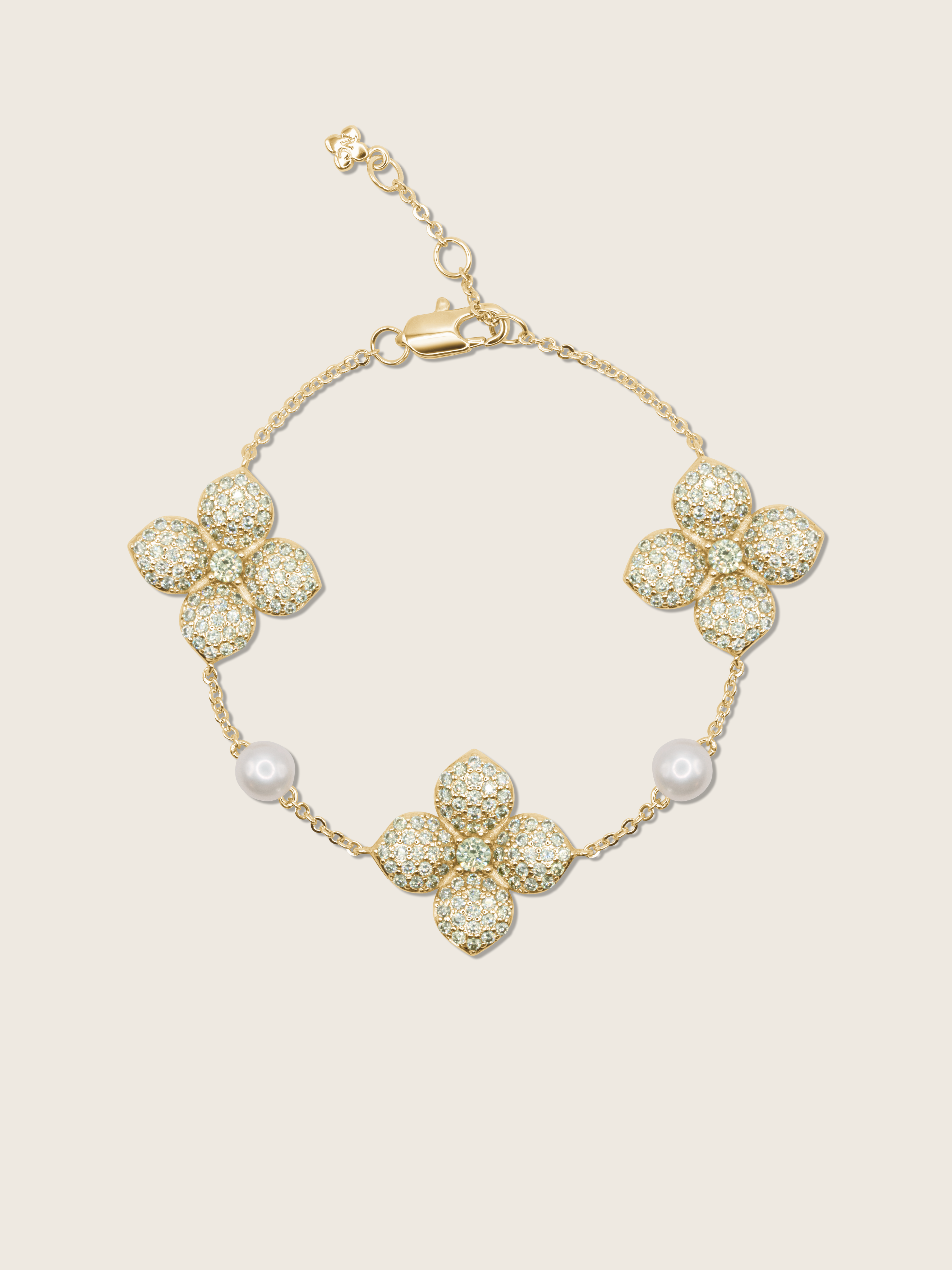 Gold-plated hydrangea bracelet with lemon yellow CZ stones and freshwater pearls, displayed on plain background