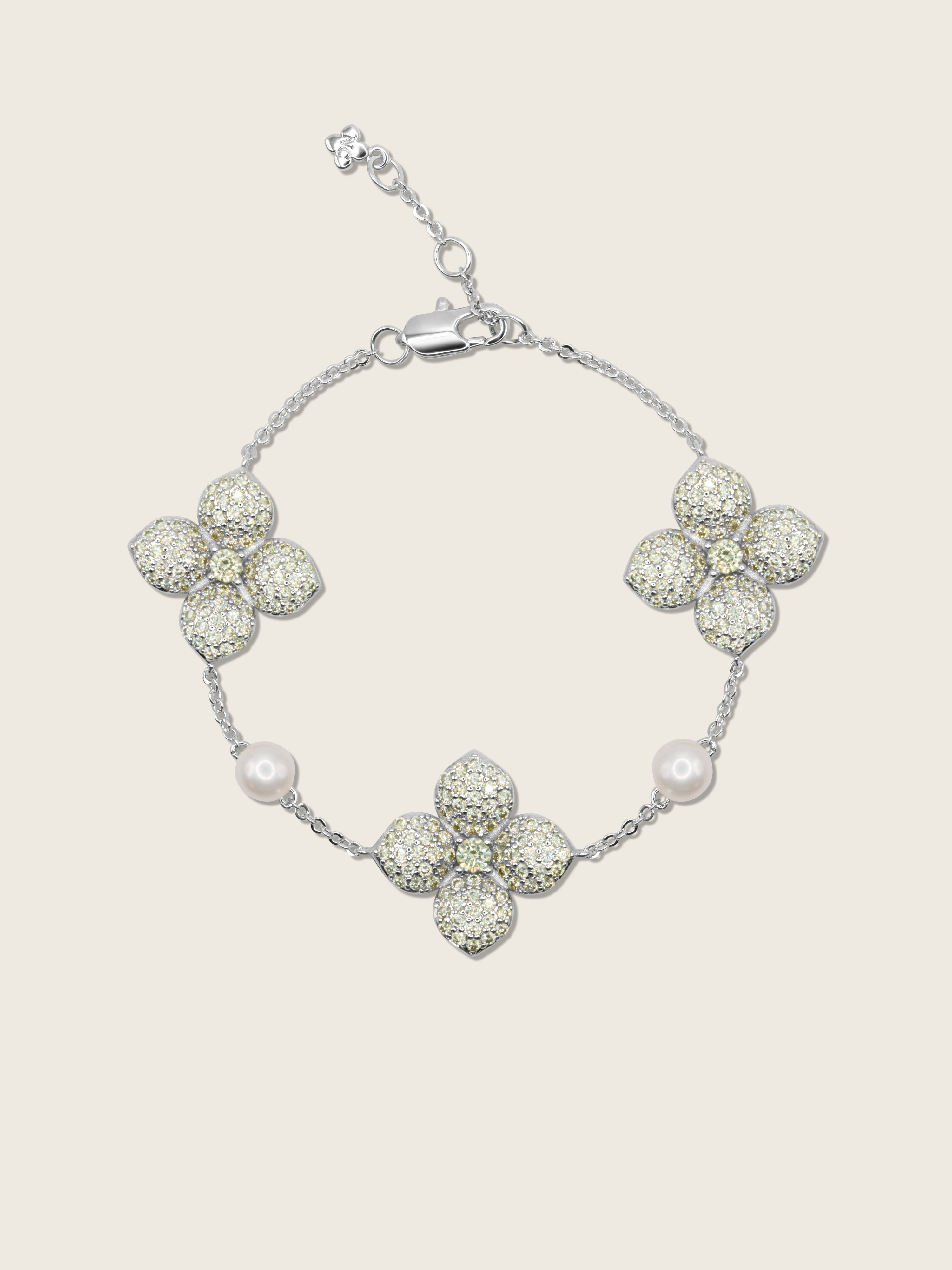 White Gold-plated hydrangea bracelet with lemon yellow CZ stones and freshwater pearls, displayed on plain background