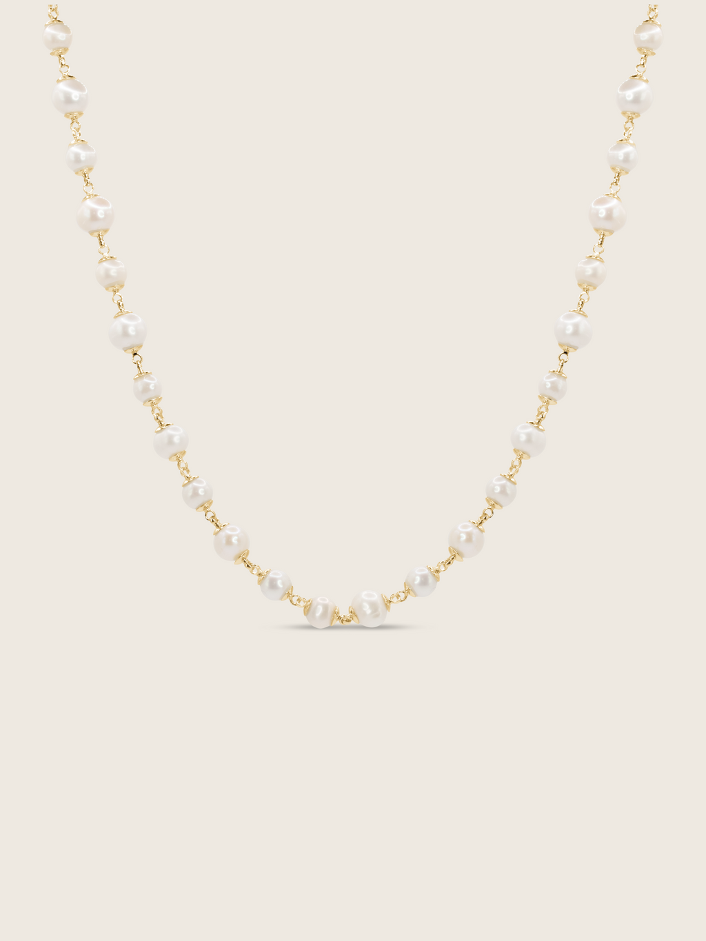 Gold-plated Margot necklace featuring alternating freshwater pearls on fine chain, displayed on white background