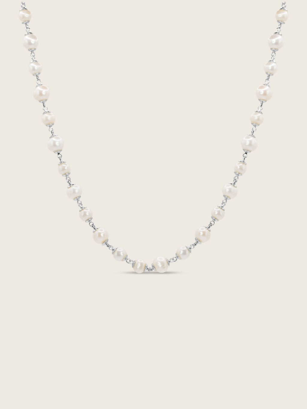 White Gold-plated Margot necklace featuring alternating freshwater pearls on fine chain, displayed on white background