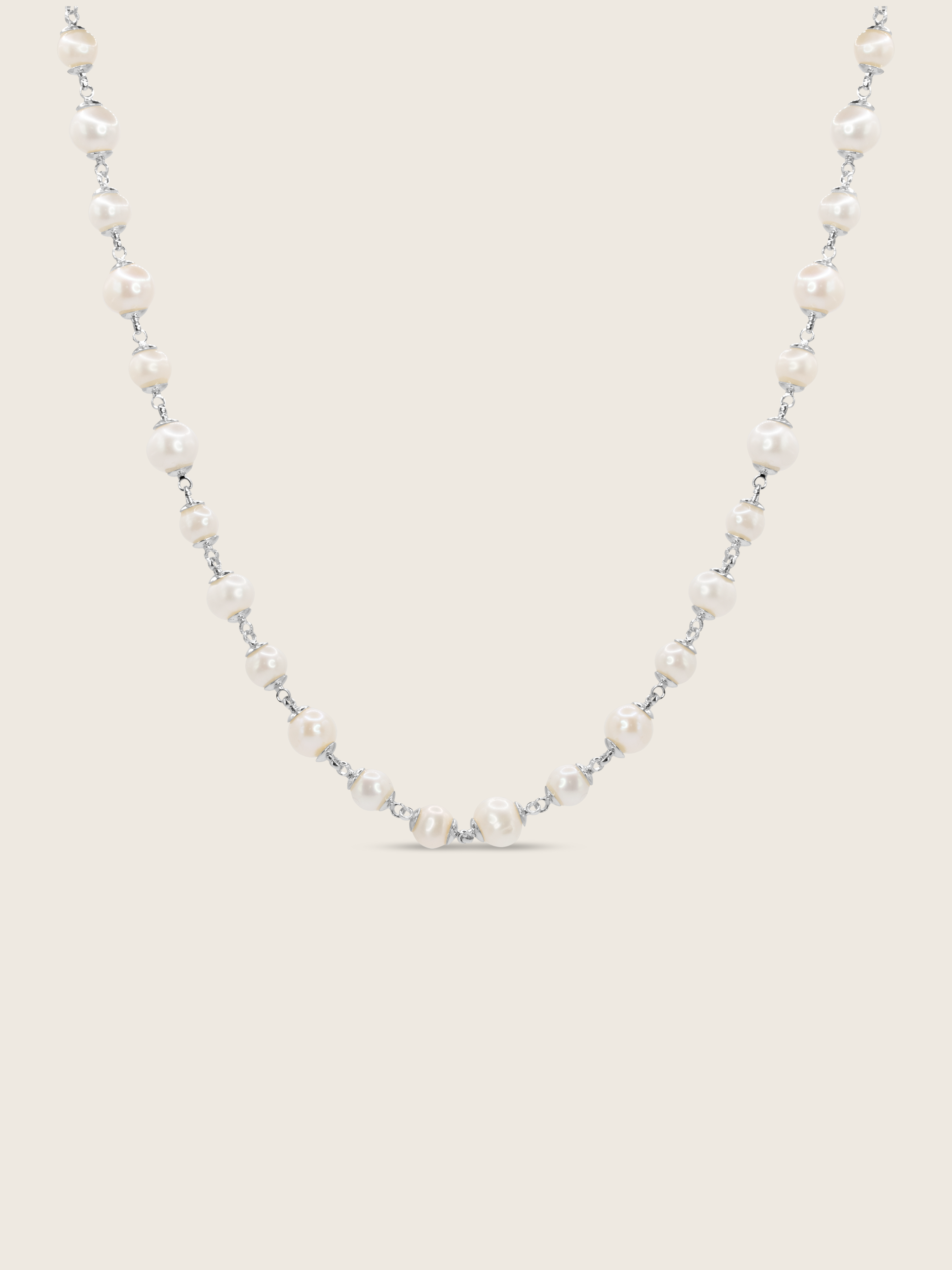 White Gold-plated Margot necklace featuring alternating freshwater pearls on fine chain, displayed on white background