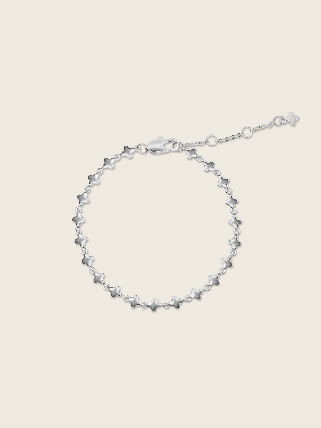 White gold plated micro hydrangea bracelet with adjustable chain displayed flat on white background