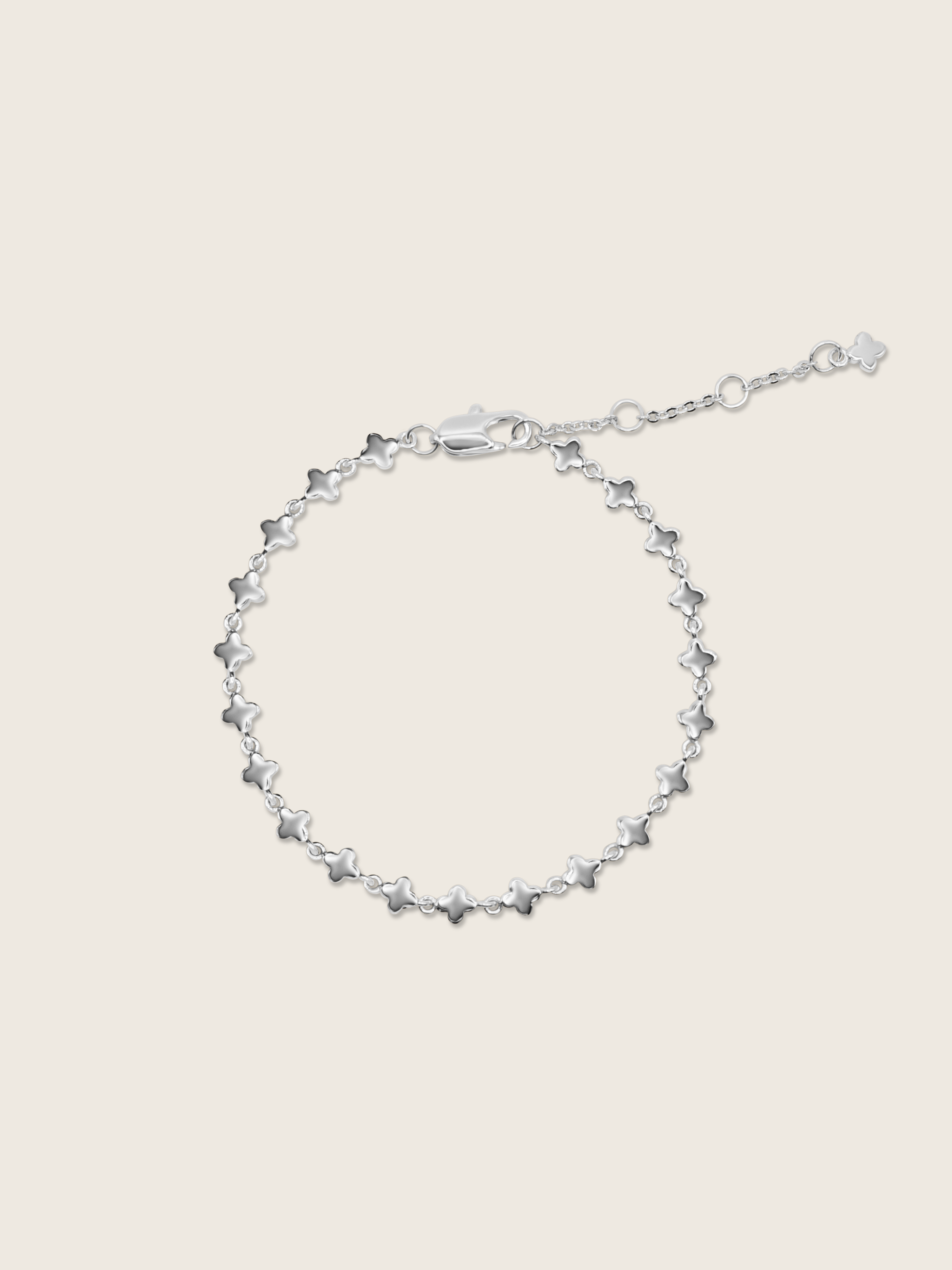 White gold plated micro hydrangea bracelet with adjustable chain displayed flat on white background
