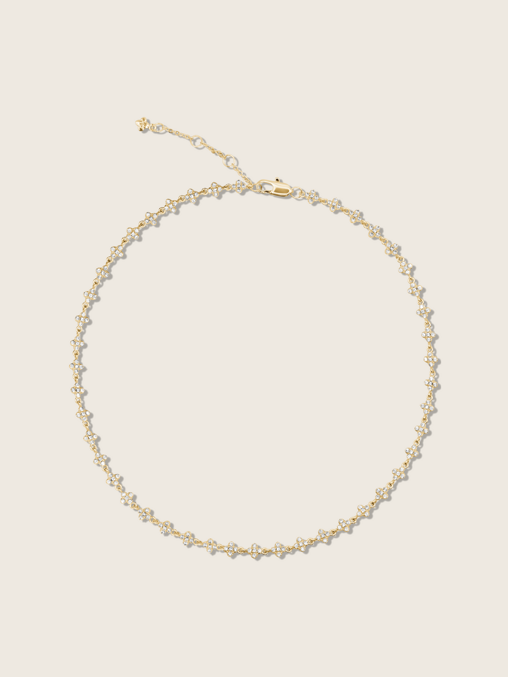 Micro hydrangea pavé necklace in gold, displayed flatly on a white background, showcasing the intricate flower pendant and detailed pavé design.