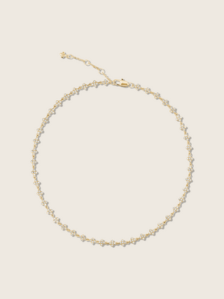 Micro hydrangea pavé necklace in gold, displayed flatly on a white background, showcasing the intricate flower pendant and detailed pavé design.