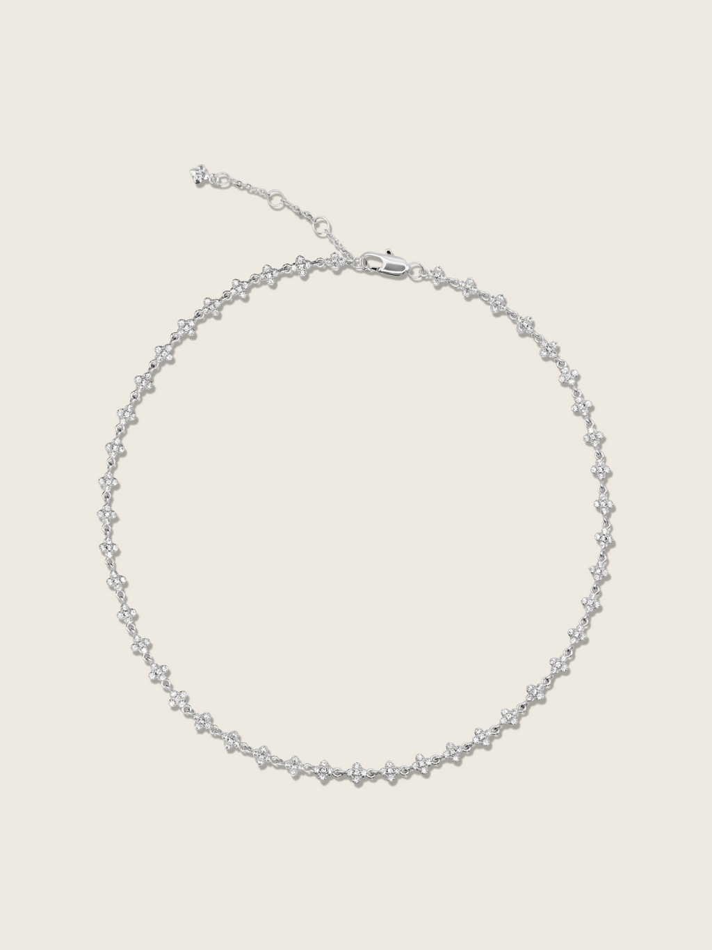 Micro hydrangea pavé necklace in white gold plated, displayed flatly on a white background, showcasing the intricate design and sparkling details of the piece.