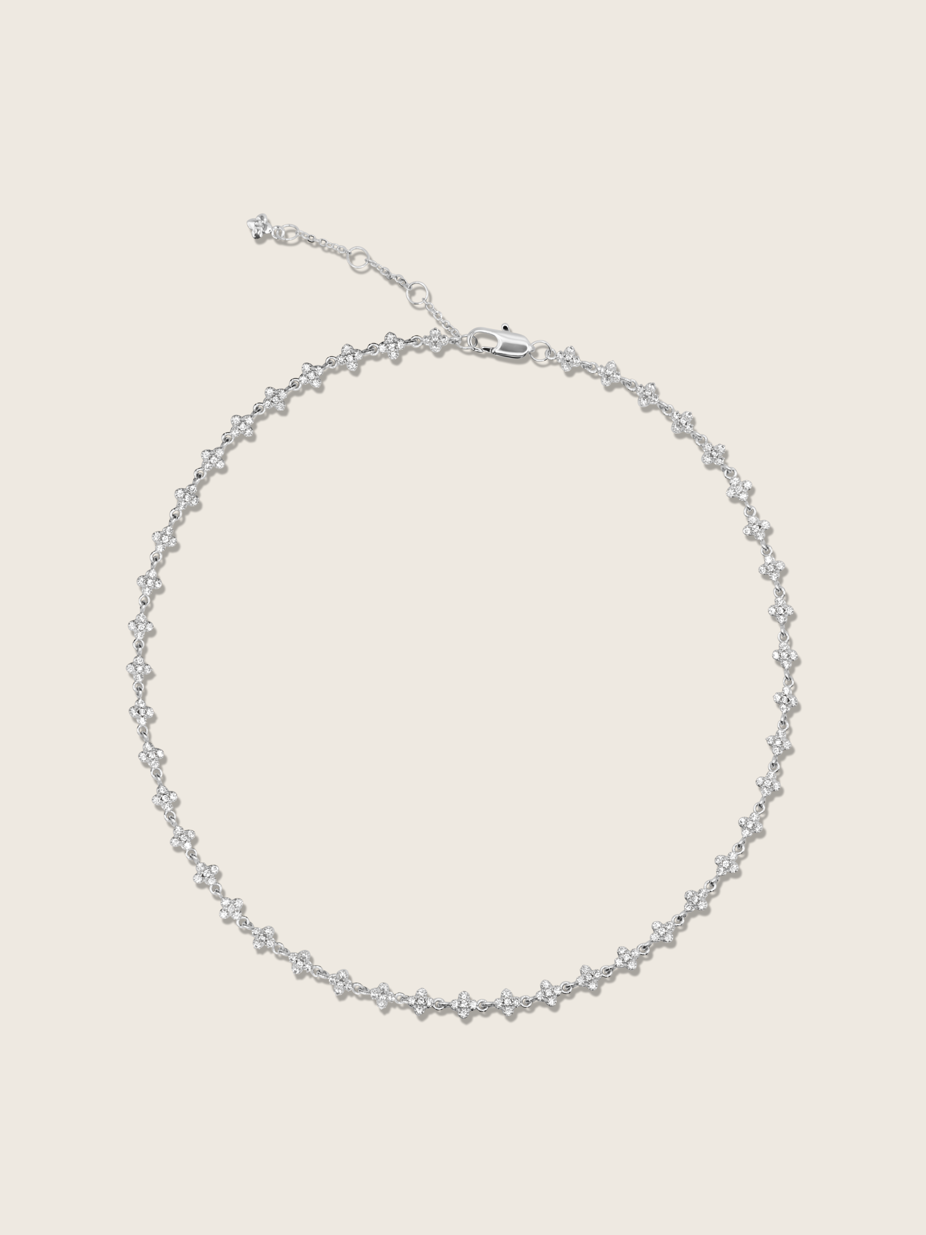 Micro hydrangea pavé necklace in white gold plated, displayed flatly on a white background, showcasing the intricate design and sparkling details of the piece.