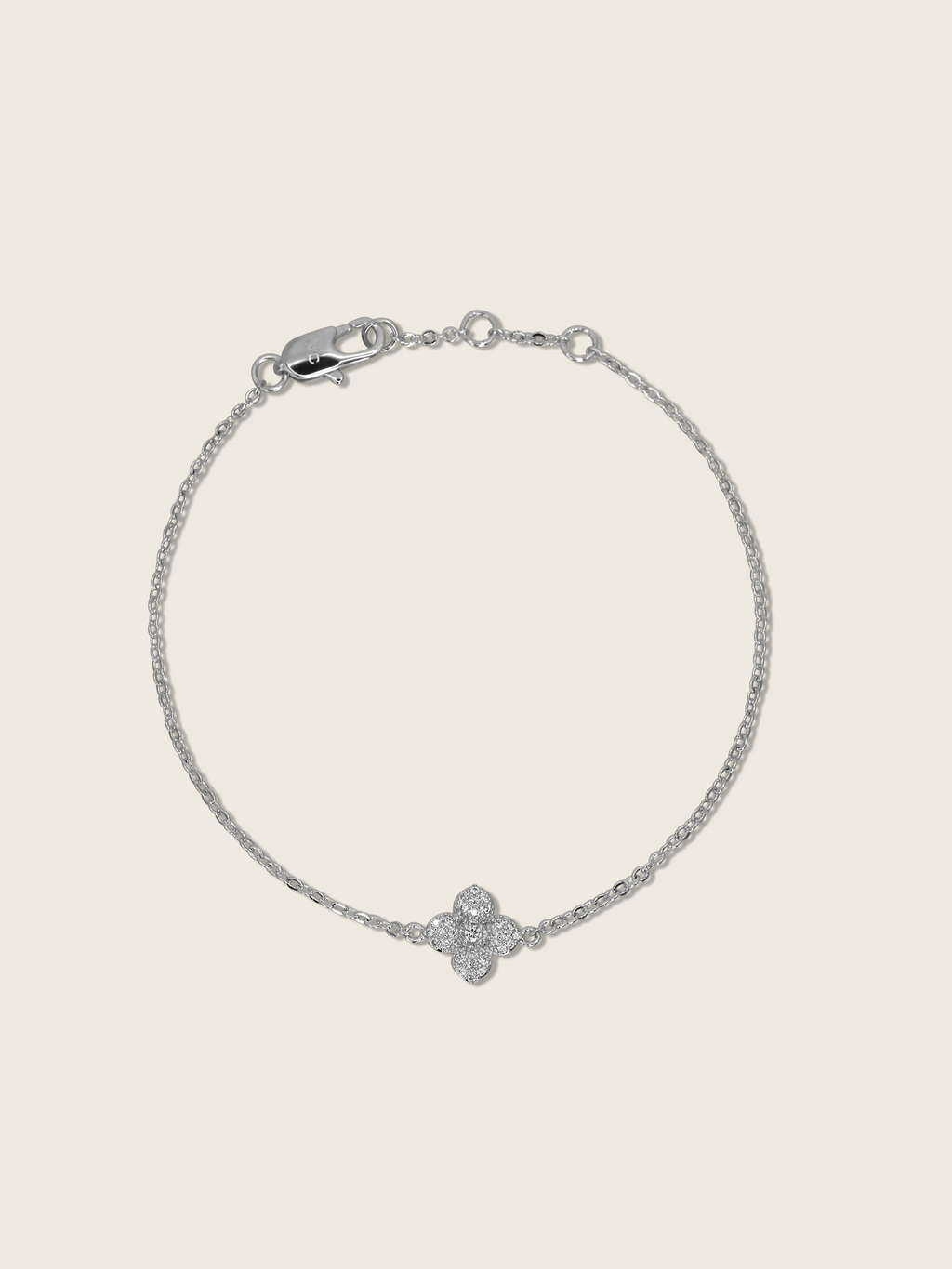 Mini hydrangea bracelet with White Gold plating shown in flatlay 