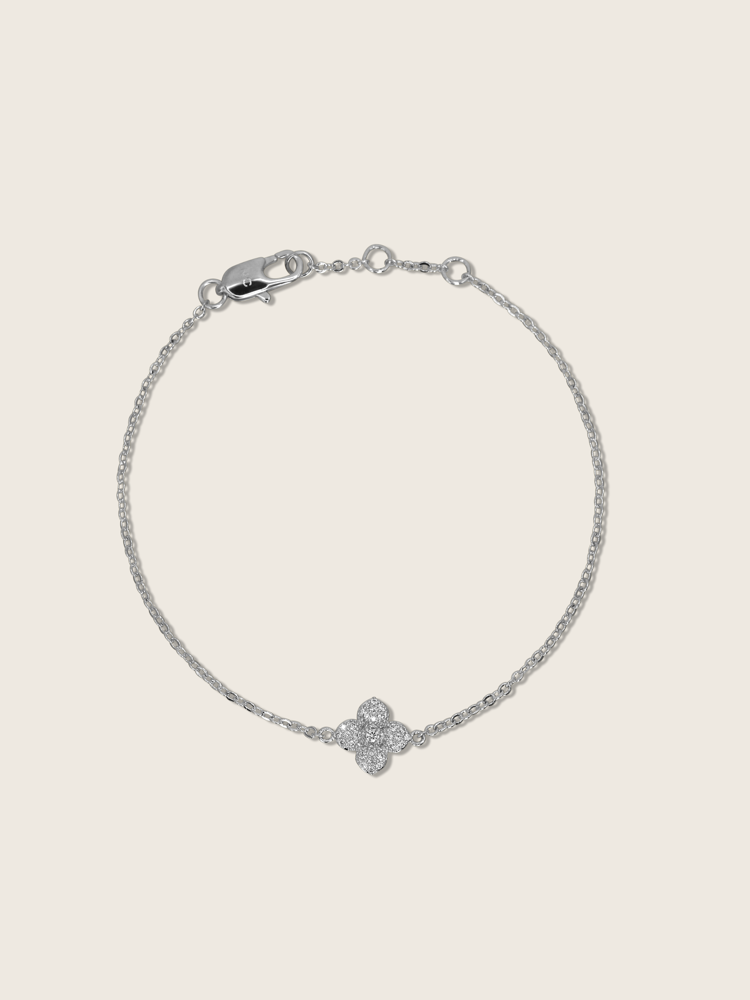 Mini hydrangea bracelet with White Gold plating shown in flatlay 