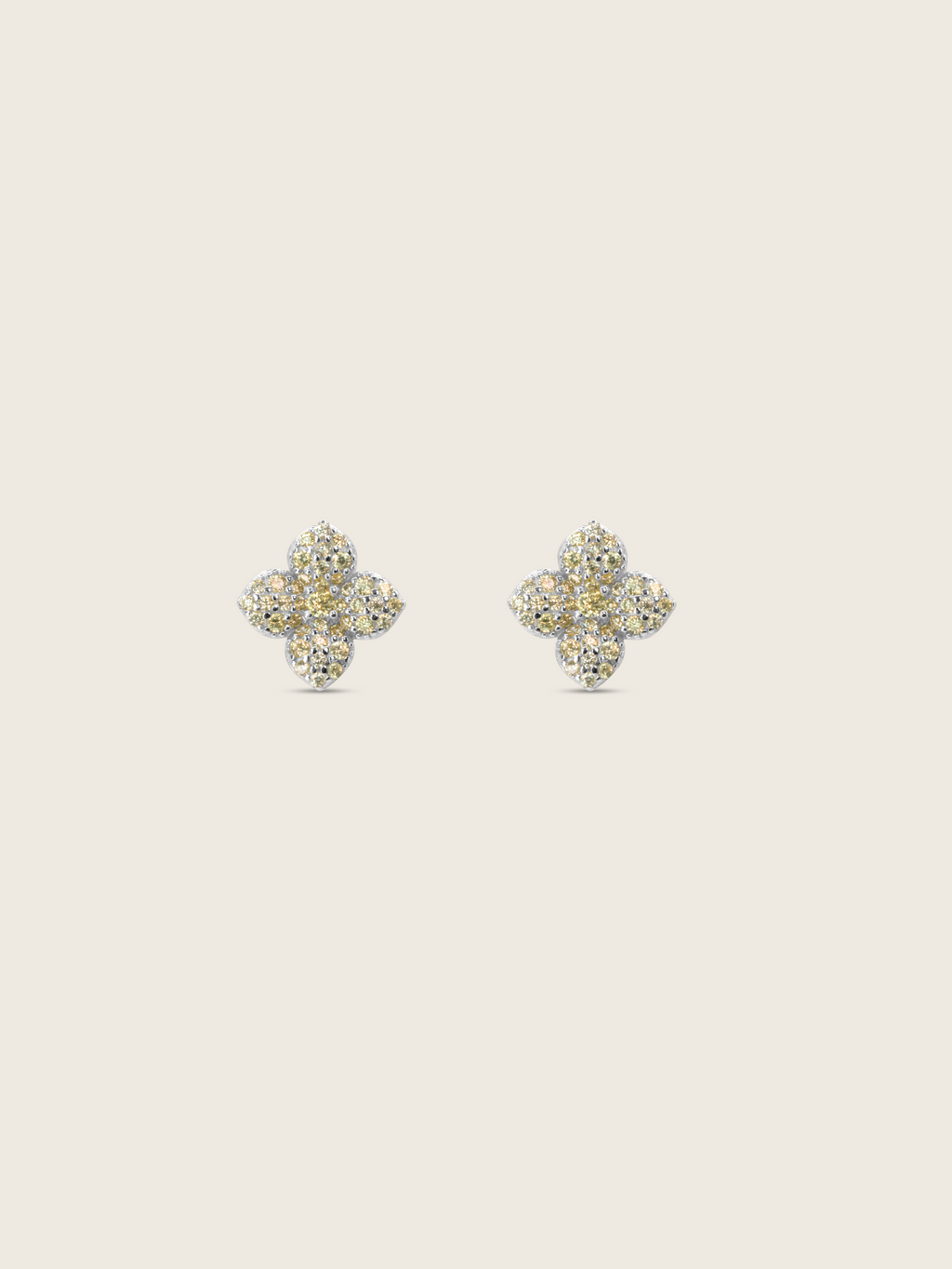 Mini hydrangea stud earrings in premium white gold with lemon yellow cubic zirconia on neutral background