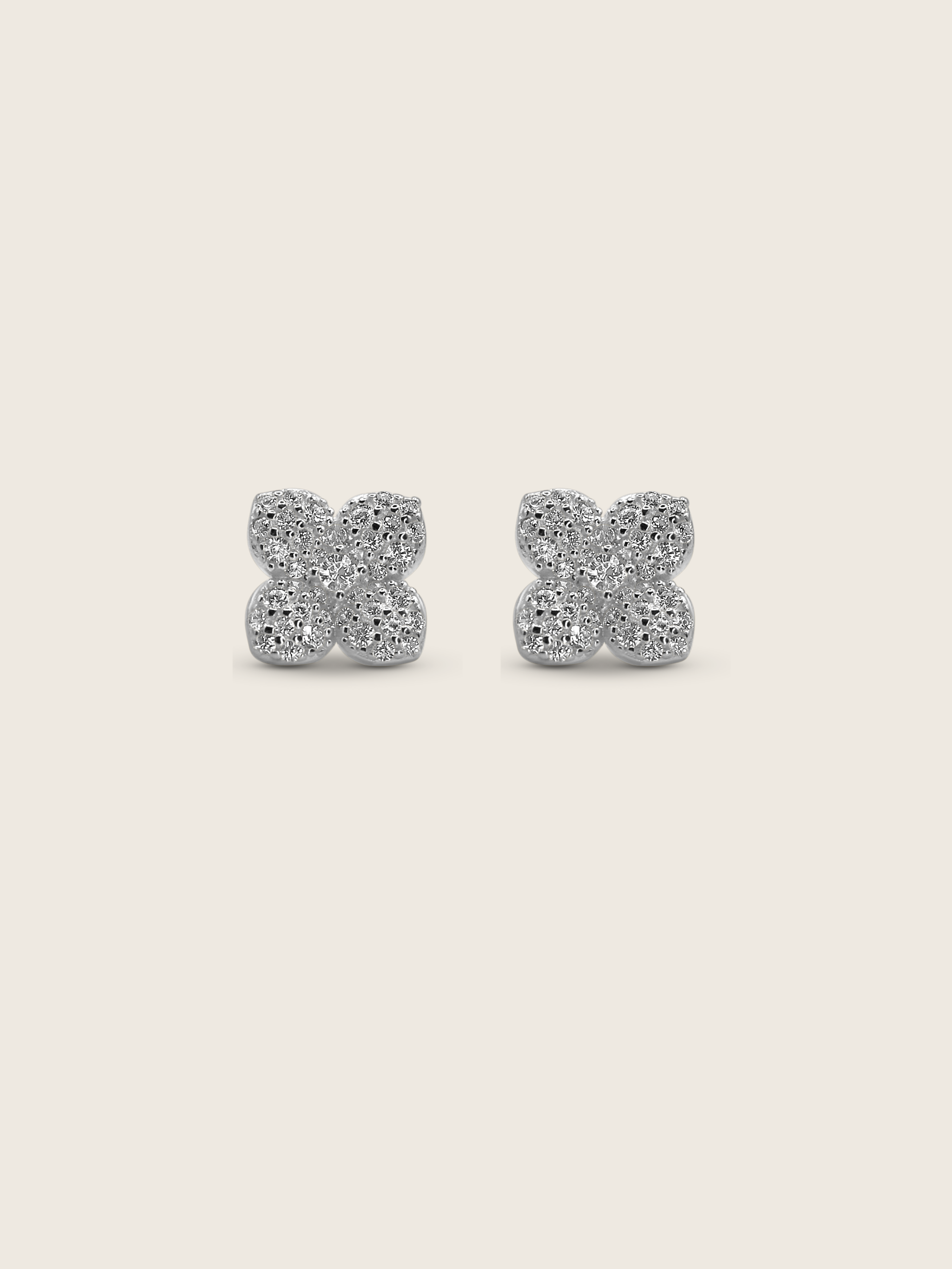 Mini Hydrangea stud earrings in premium White Gold plating with dainty pavé petals in a symmetrical four-leaf floral shape