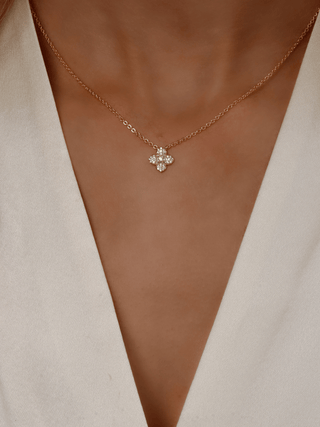 Mini Lemon Drop Hydrangea necklace in 14k Gold plating, shown on model’s neckline with small lemon CZ floral pendant and fine adjustable chain.