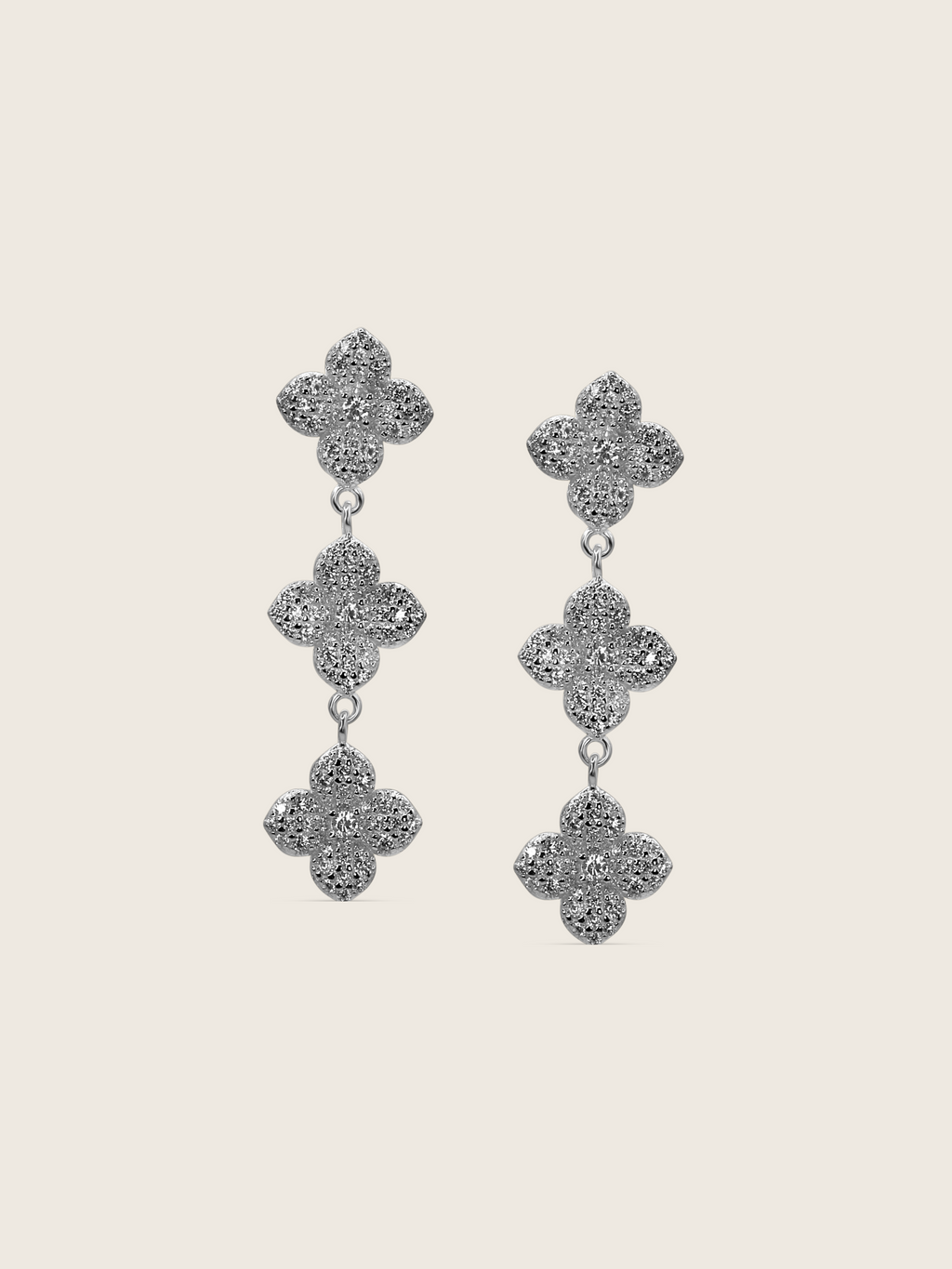 Mini Triple Hydrangea drop earrings in premium White Gold plating, featuring three dainty pavé flower motifs linked in a vertical cascade