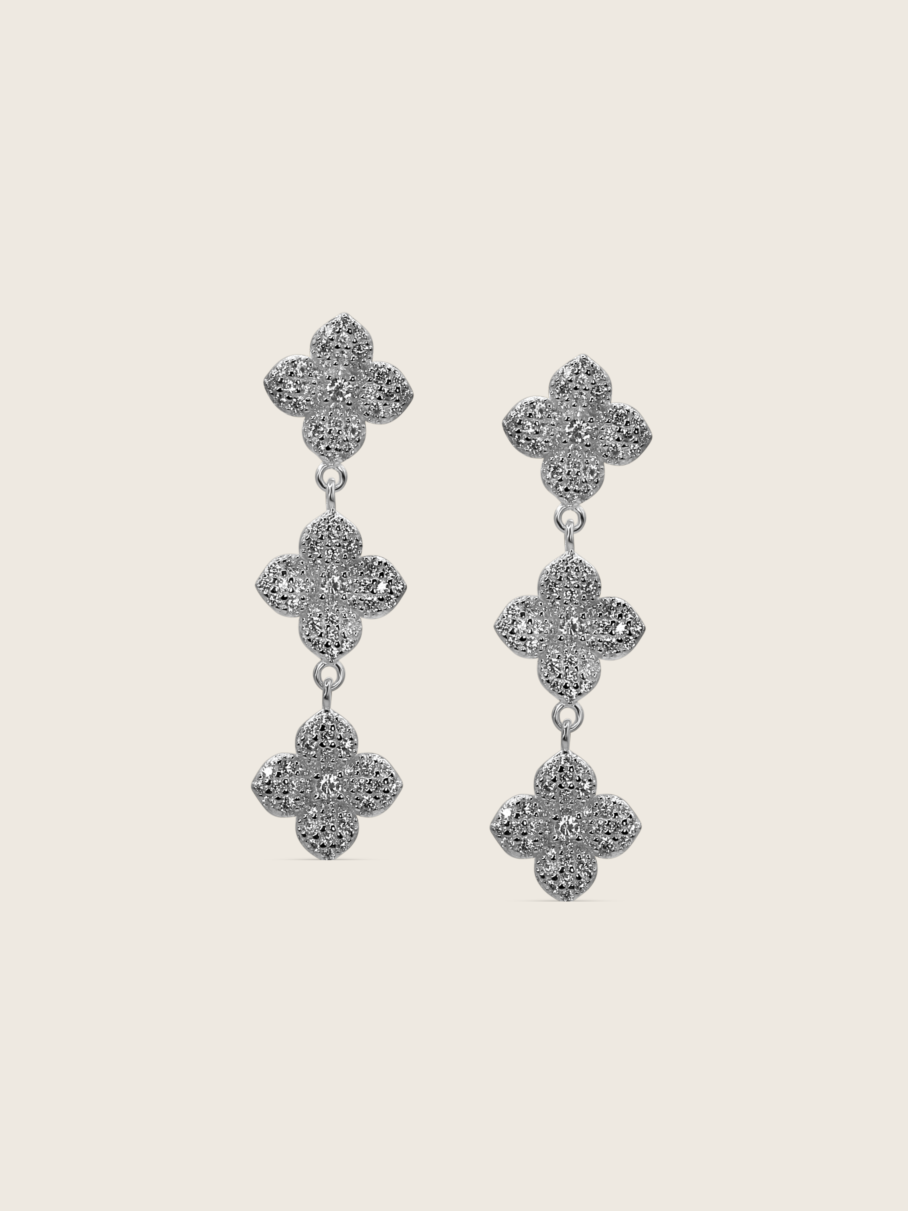 Mini Triple Hydrangea drop earrings in premium White Gold plating, featuring three dainty pavé flower motifs linked in a vertical cascade
