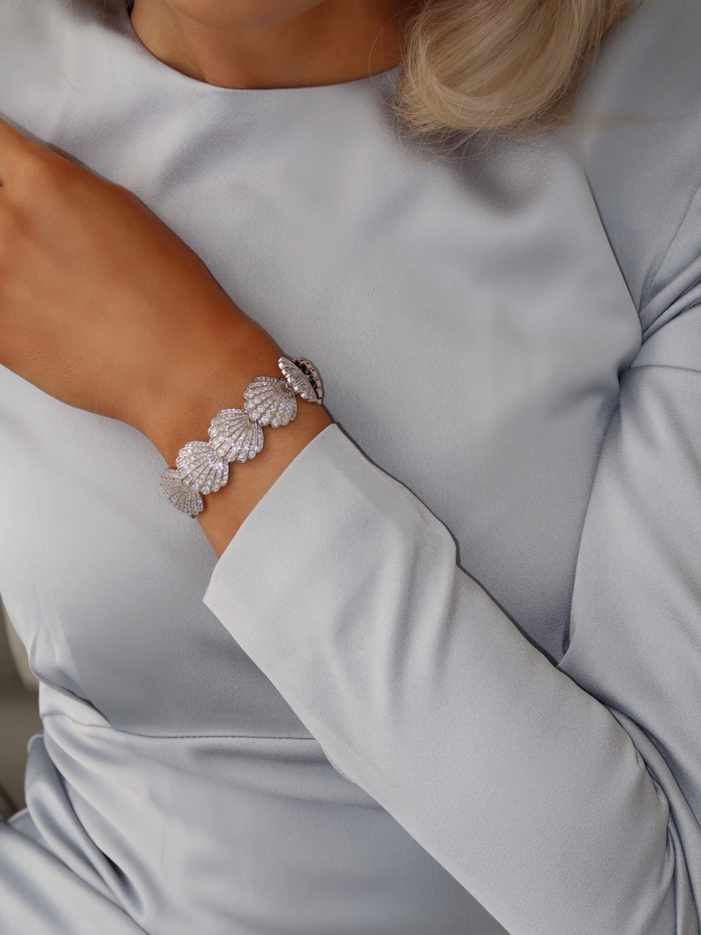 Muriel pavé bracelet in premium White Gold plating with CZ stones, styled with soft blue satin sleeve