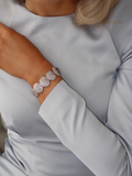 Muriel pavé bracelet in premium White Gold plating with CZ stones, styled with soft blue satin sleeve