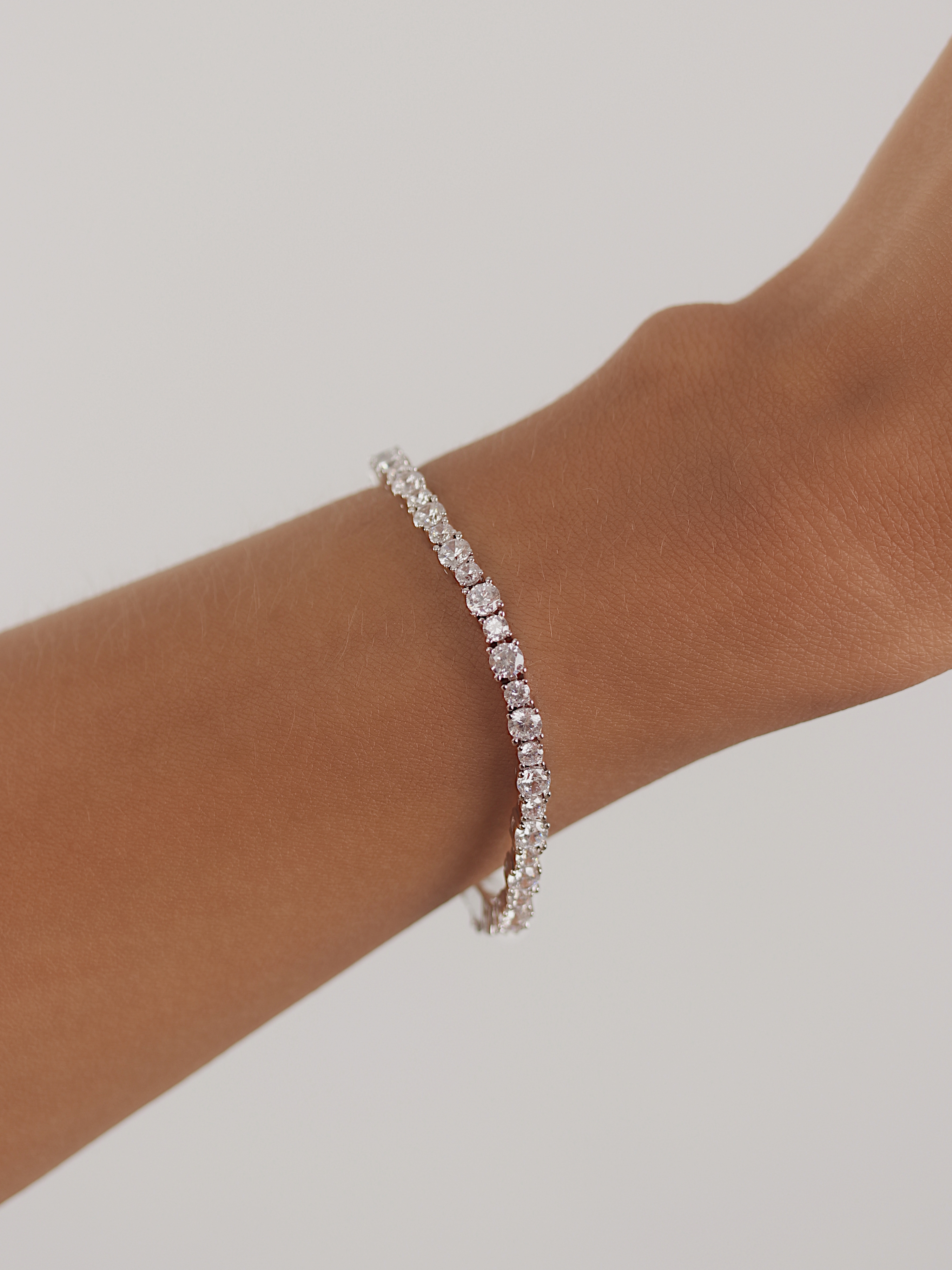 Nova tennis bracelet premium white gold plated cubic zirconia jewellery styled on model wrist
