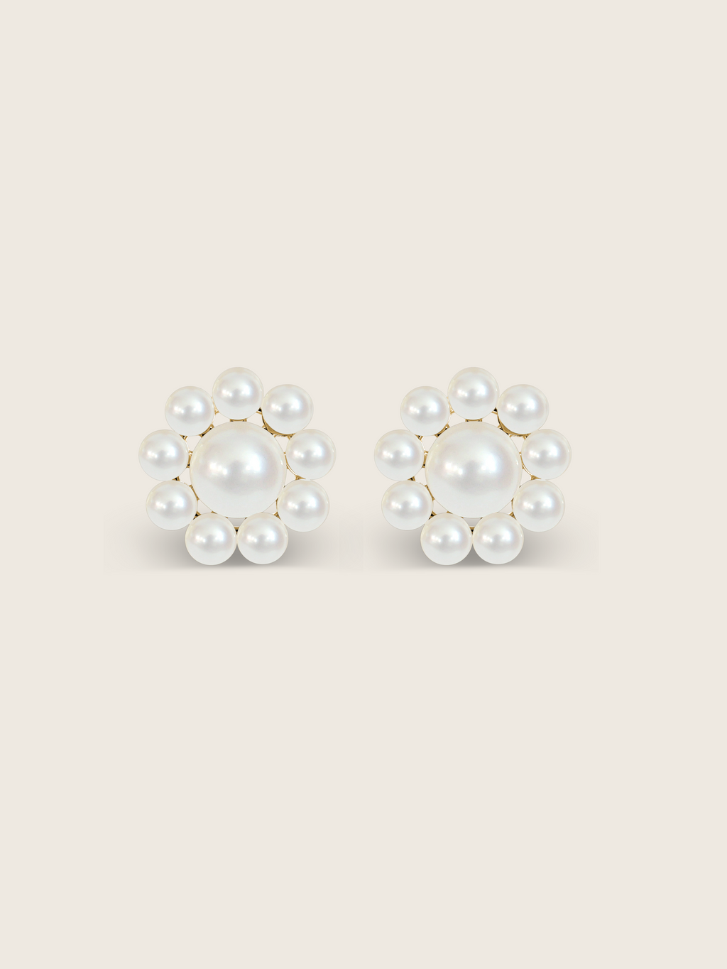 Lustrous pearl stud earrings with gold settings on a clean white background, product detail view