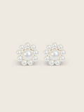 Lustrous pearl stud earrings with gold settings on a clean white background, product detail view