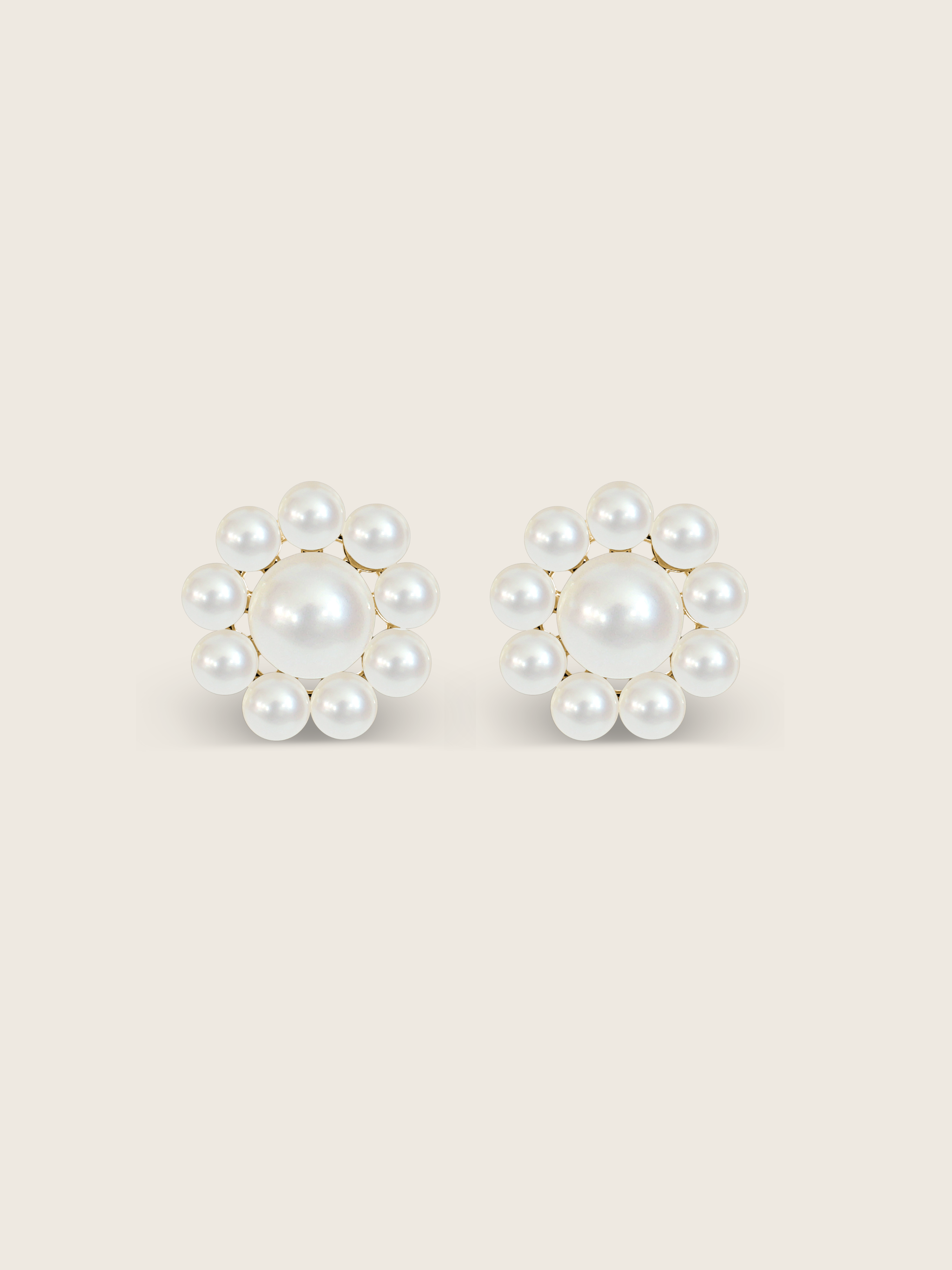 Lustrous pearl stud earrings with gold settings on a clean white background, product detail view