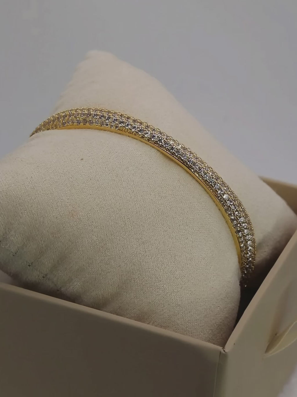Video of the Christy pavé bangle in 14k gold plating rotating under light to showcase its CZ sparkle