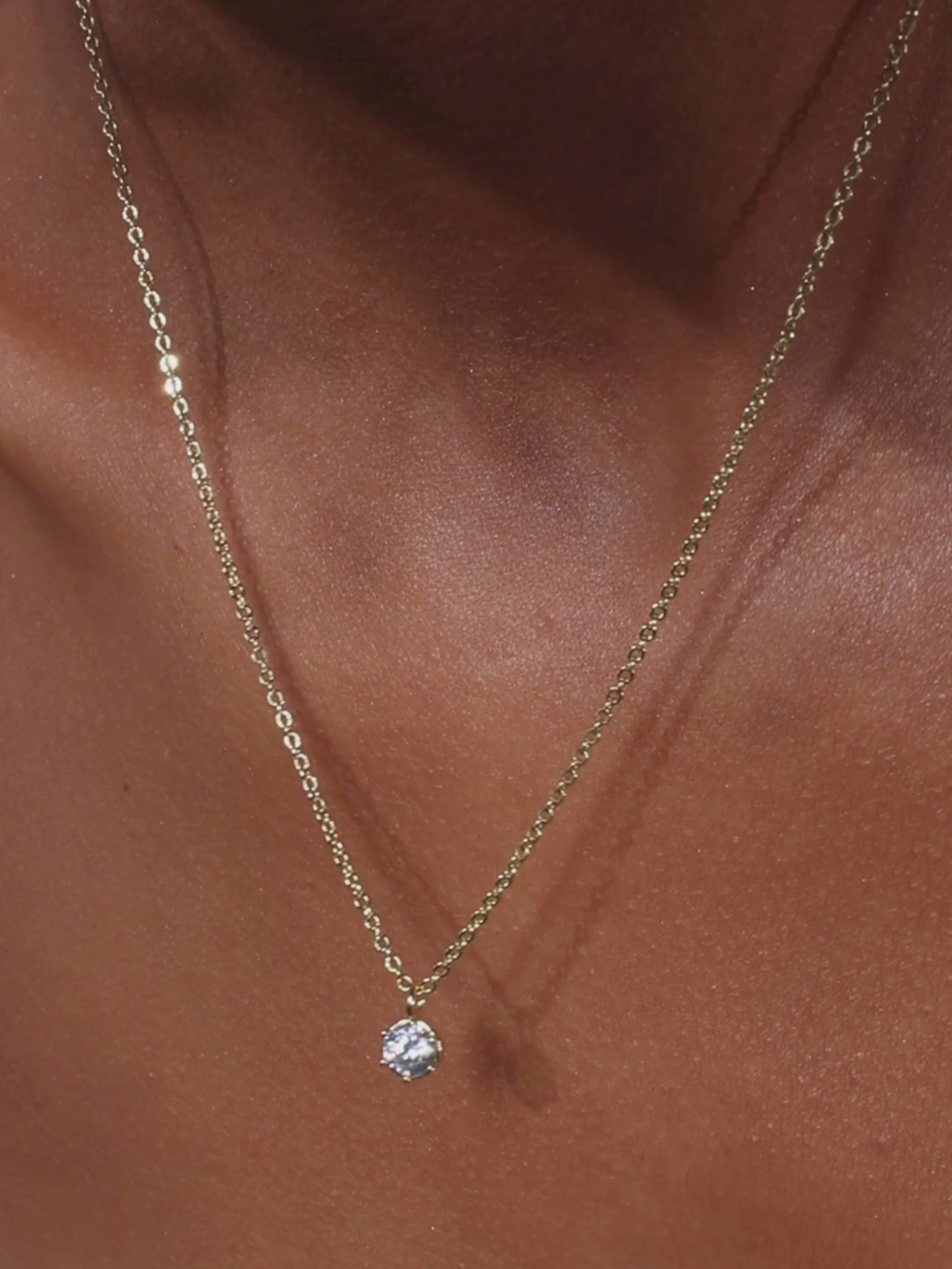 Video of Luna gold pendant necklace with cubic zirconia stone on 14k gold plated brass chain, showing sparkle and movement