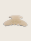 Branded vanilla claw hair clip displayed on a clean white background, offering a sleek, minimalist design for effortless styling with a touch of luxury.