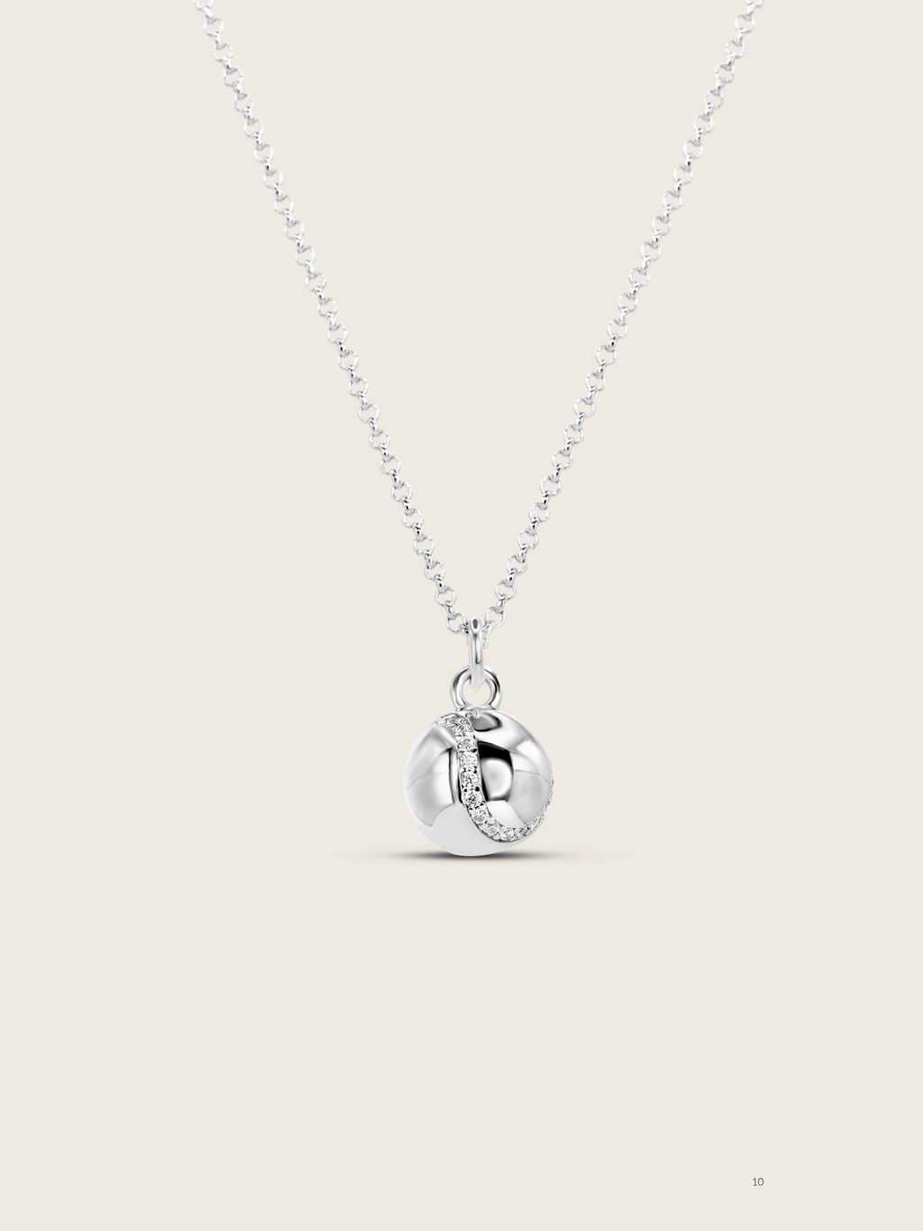 White gold plated tennis ball necklace with a seam of pavé CZ stones on a fine chain