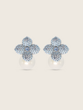 White gold plated hydrangea flower earrings with light blue cubic zirconia and shell pearl drop on white background. Sparkly floral stud earrings