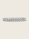White gold plated heart tennis bracelet with bezel-set heart-cut cubic zirconia stones, a romantic and elegant twist on a classic silhouette