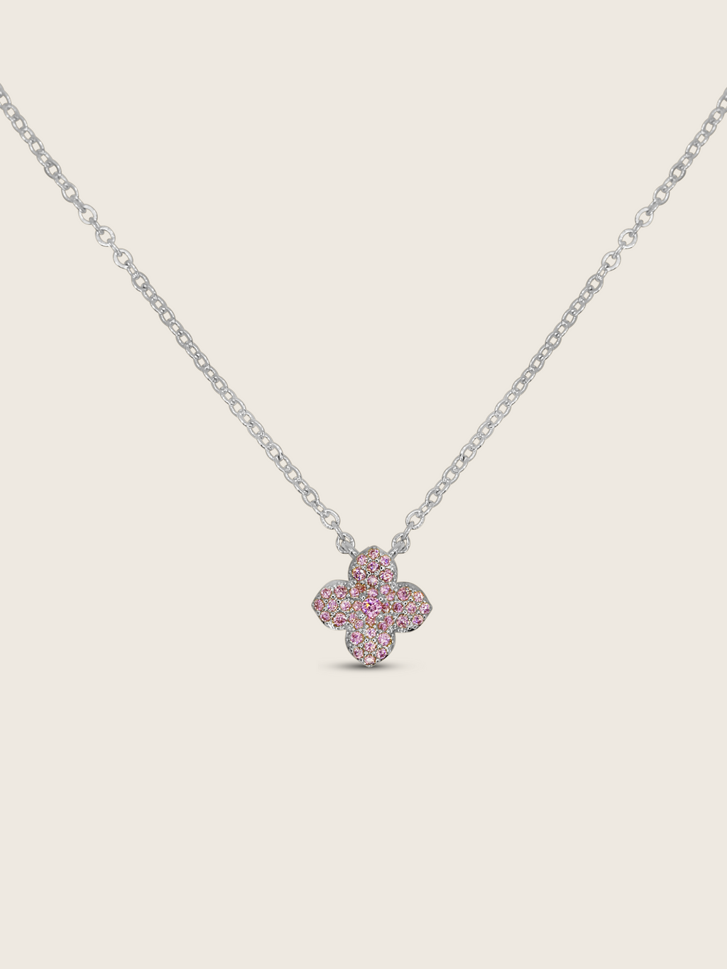 Mini hydrangea necklace with light pink cubic zirconia stones and pink centre gem, set in white gold plating, delicate floral pendant on fine chain
