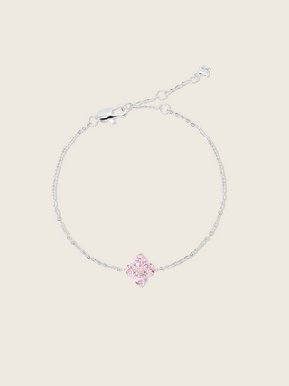 mini crystal hydrangea bracelet witha blush clover shaped stone motif, sparkling on a neutral background