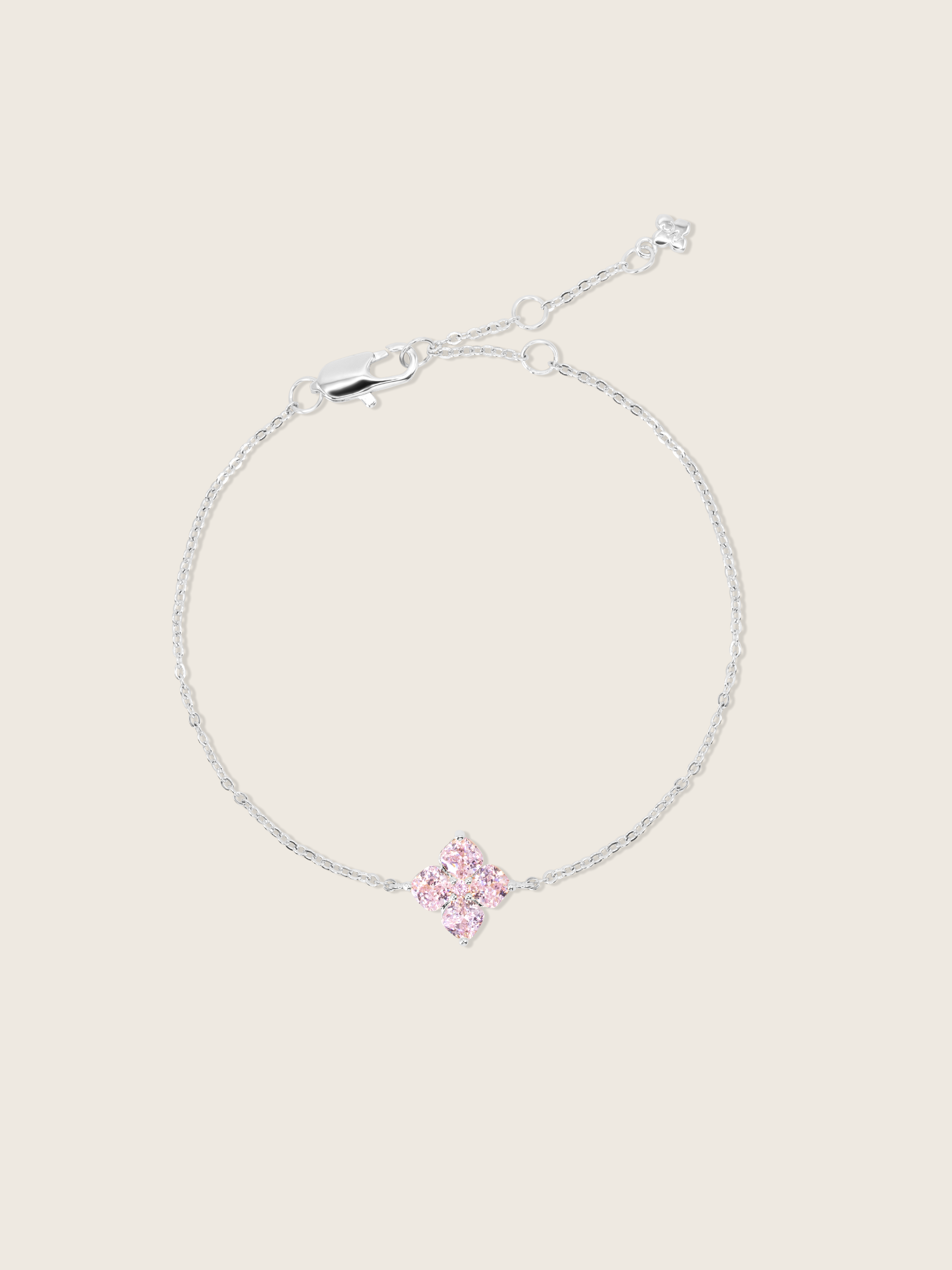 mini crystal hydrangea bracelet witha blush clover shaped stone motif, sparkling on a neutral background